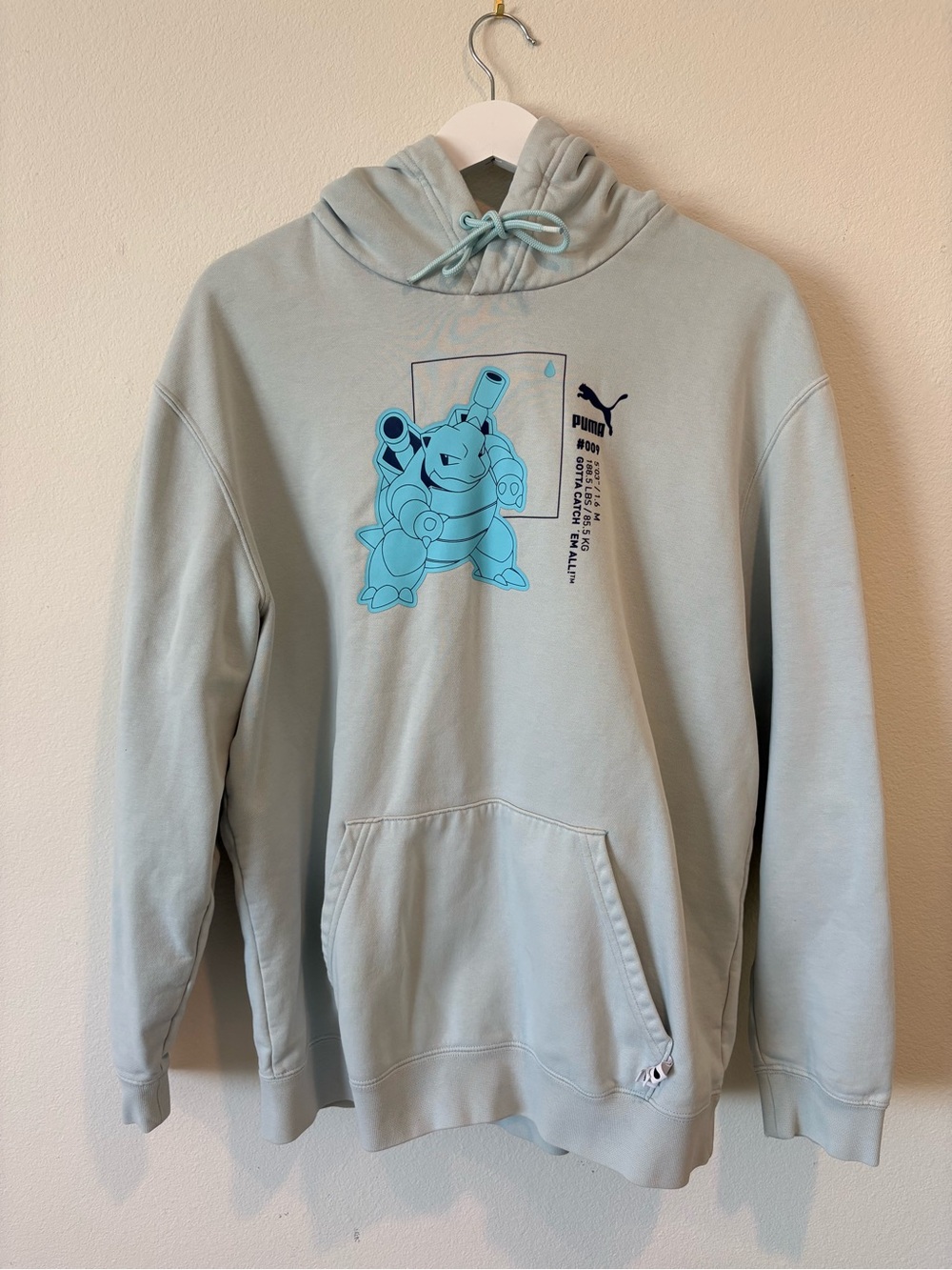 Puma x Pokemon collaboration Men’s aqua blue pullover hoodie.